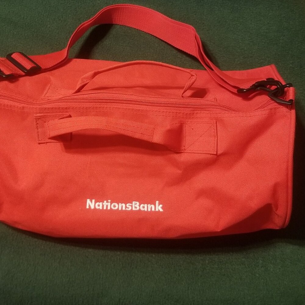 small red duffel bag, some small stains